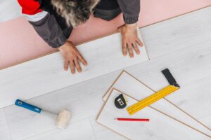Professional flooring contractor installing premium flooring materials