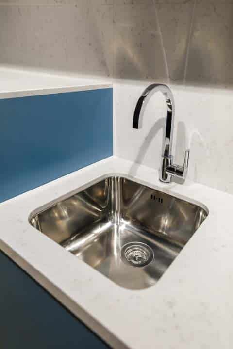 metal sink in renovated kitchen