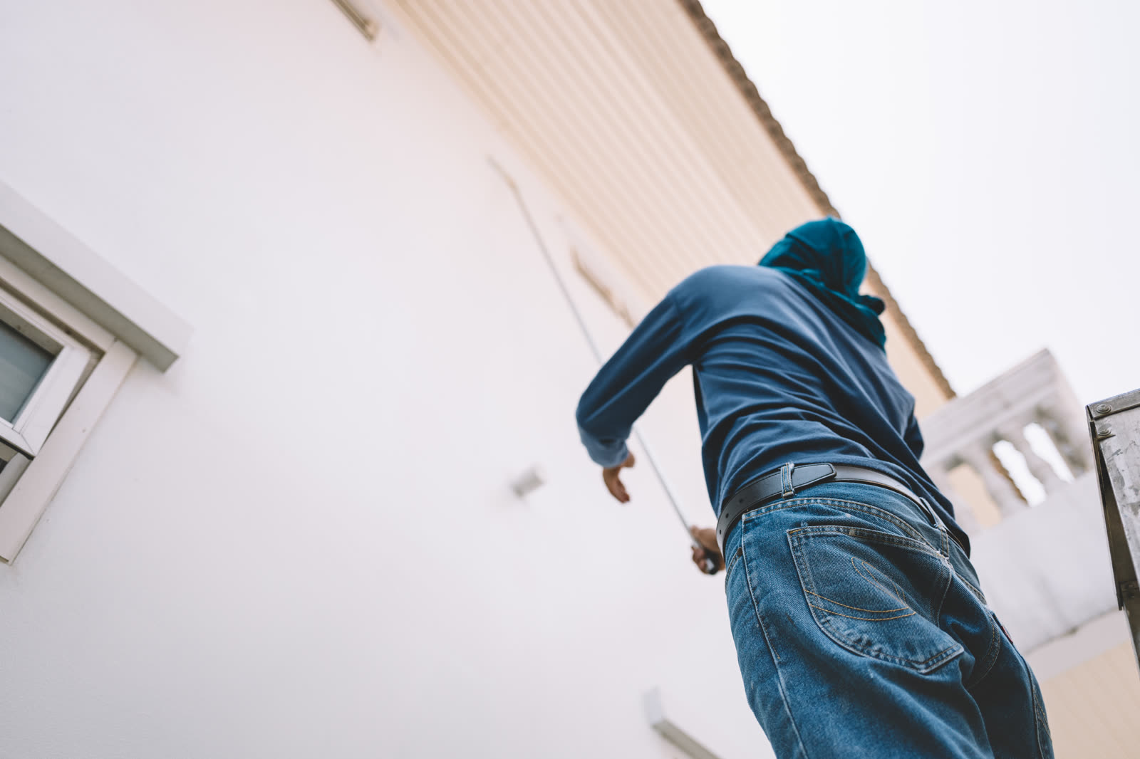 man painting white wall — Drywall Repair & Patching in Sarasota, FL
